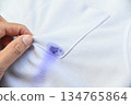 blue blue ink dirty stain  on white shirt for cleaning concept idea in work house 134765864