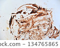top view of dirty chocolate stain on table for cleaning concept 134765865