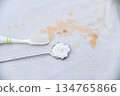 baking soda with brush for clean stain on shirt in daily life 134765866