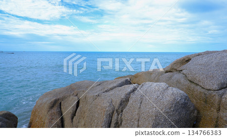 Rocky Shore with Blue Sky and Sea Scenery 134766383