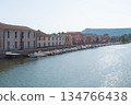 Historic residential buildings along a calm river in a European town. Soft light and peaceful atmosphere of slow travel, Bosa, Italien 134766438