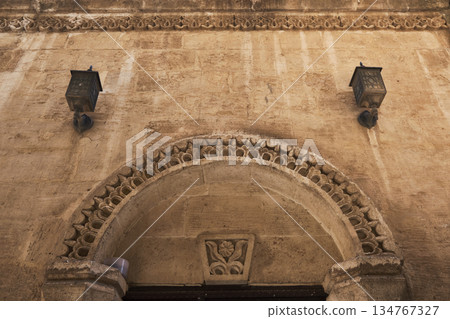 Ornate Stone Arch on Historic Building Facade 134767327