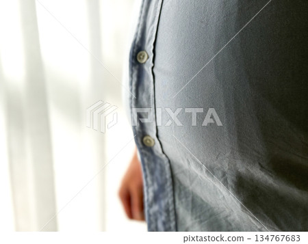 Middle-aged man with a chubby belly Middle-aged man with a chubby belly 134767683