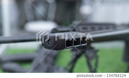 Highres firearm component imagery, Detailed view of weapon muzzle and barrel, Sharp highresolution image highlighting firearm construction details and intricate surface textures Highres firearm component imagery, Detailed view of weapon muzzle and barrel, Sharp highresolution image highlighting firearm construction details and intricate surface textures 134768124