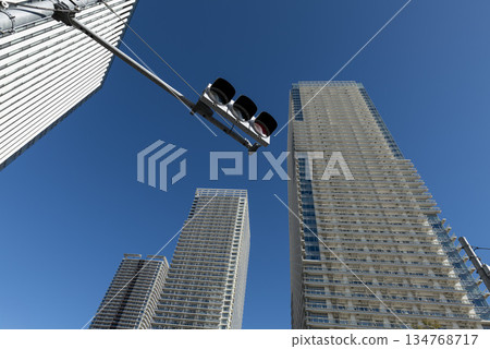 Blue sky, high-rise apartment buildings and traffic lights Blue sky, high-rise apartment buildings and traffic lights 134768717