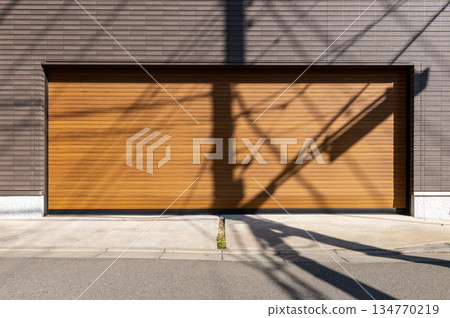 A closeup shot of automatic metal roller door used in factory, storage, garage, and industrial warehouse. The corrugated and foldable metal sheet offer space saving and provide urban and rustic feel 134770219