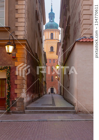 Narrow Alley and Tower in Old Town Warsaw Poland 134770611