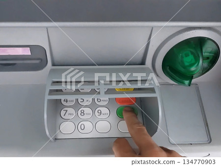 ATM for receiving funds. Hands of a man at an ATM. ATM for receiving funds. Hands of a man at an ATM. 134770903