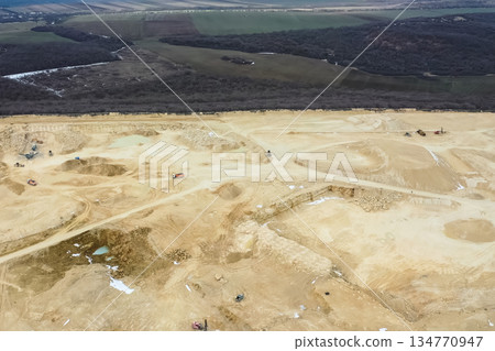 Clay quarry, top view. Clay mining in quarry. Clay quarry, top view. Clay mining in quarry. 134770947