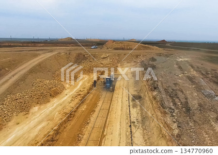 Shell quarry quarry. Cutting seashell into blocks right away in a quarry. 134770960
