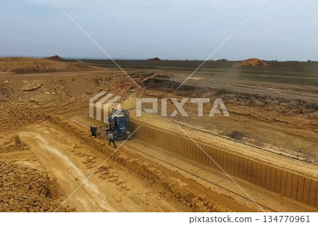 Shell quarry quarry. Cutting seashell into blocks right away in a quarry. 134770961