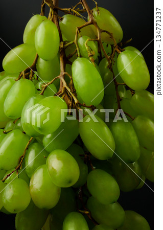 A bunch of table grapes on a black background 134771237