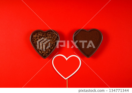 Heart coffee. Roasted coffee beans in the shape of heart on bright red background. Concept of coffee love, Valentines Day, 134771344