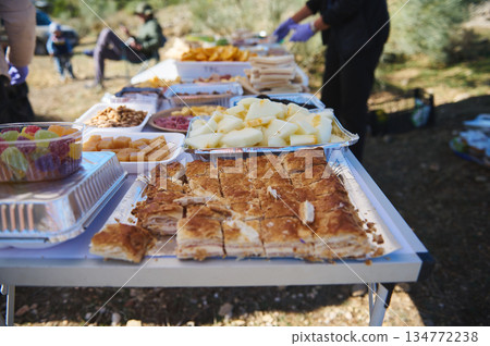 Outdoor Buffet Table With Pastry, Fruit, And Cheese At A Community Event And Picnic Outdoor Buffet Table With Pastry, Fruit, And Cheese At A Community Event And Picnic 134772238