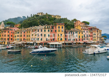 Colorful waterfront buildings and boats in the harbor Portofino, Italy 134772317