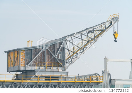 Industrial Harbor Cargo Crane with Hook and Lattice Boom, Venice Italy Industrial Harbor Cargo Crane with Hook and Lattice Boom, Venice Italy 134772322