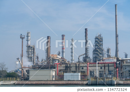 Industrial Refinery Complex with Smokestacks in Porto Marghera Venice, Italy 134772324