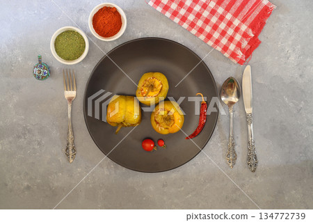 Green stuffed peppers with rice, tomatos and red hot chili pepper. 134772739