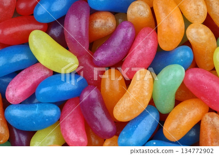 Colorful candy beans as texture and background for design. Close up view of jelly candy beans with selective focus. Colorful candy beans as texture and background for design. Close up view of jelly candy beans with selective focus. 134772902