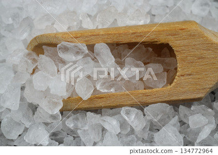 sea salt in a spoon isolated on black background sea salt in a spoon isolated on black background 134772964