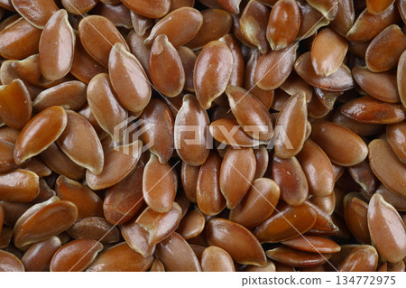 Pile of flax seeds isolated on white background 134772975