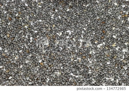 Chia seeds in wooden spoon. Healthy superfood rich in Omega 3 fatty acids. 134772985