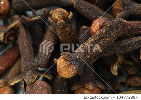 Dry spice cloves background and texture, top view flat lay cloves spice dried cloves. Dry spice cloves background and texture, top view flat lay cloves spice dried cloves. 134772987