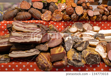 Cured dried meat on market stall 134773018
