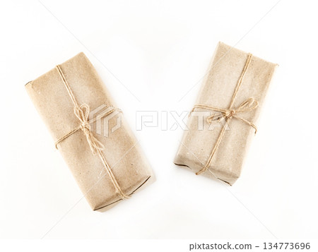 Two brown boxes with a string tied to them Two brown boxes with a string tied to them 134773696