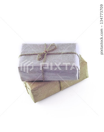 Two brown boxes with a string tied to them Two brown boxes with a string tied to them 134773709