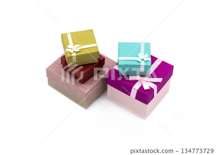 many small gift boxes of bright colors on a light background 134773729