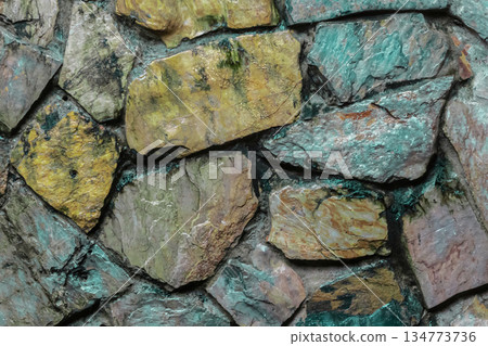 A wall made of stone with a brown and gray color A wall made of stone with a brown and gray color 134773736