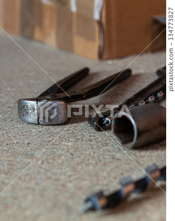 several different tools lie on a light surface close-up 134773827