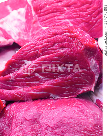 counters with beef meat in a large plan, large pieces 134773892
