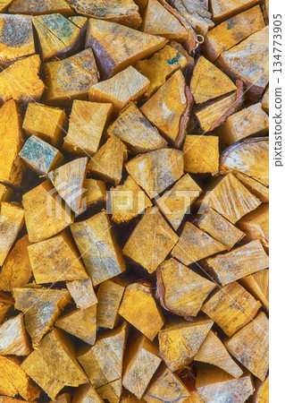 stacked lots of wooden logs for a fireplace or stove stacked lots of wooden logs for a fireplace or stove 134773905