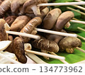 assorted mushroom skewers and vegetables on wooden skewers selective focus 134773962