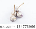 young garlic lies on a light background. fresh vegetables 134773966