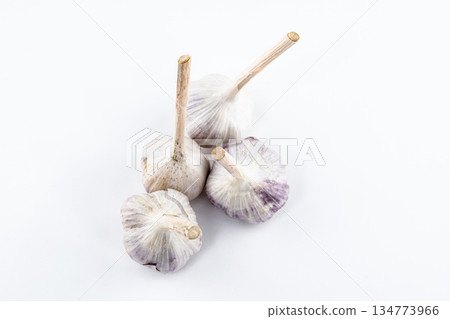 young garlic lies on a light background. fresh vegetables 134773966