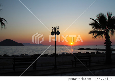 Seaside town of Turgutreis and spectacular sunsets Seaside town of Turgutreis and spectacular sunsets 134774182
