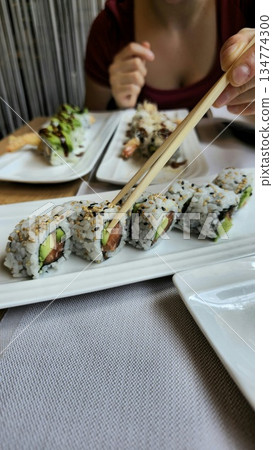 Delicious Sushi Rolls Served on a Platter Delicious Sushi Rolls Served on a Platter 134774300