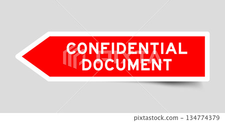 Red color arrow shape sticker label with word confidential document on gray background Red color arrow shape sticker label with word confidential document on gray background 134774379