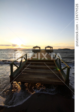 Old abandoned wooden fishing pier on the sea in the countryside Old abandoned wooden fishing pier on the sea in the countryside 134774526