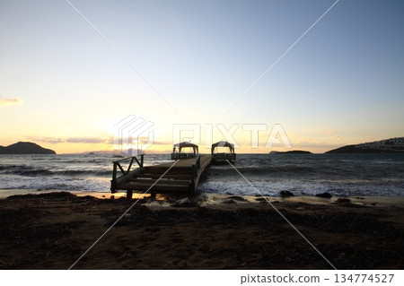 Old abandoned wooden fishing pier on the sea in the countryside 134774527