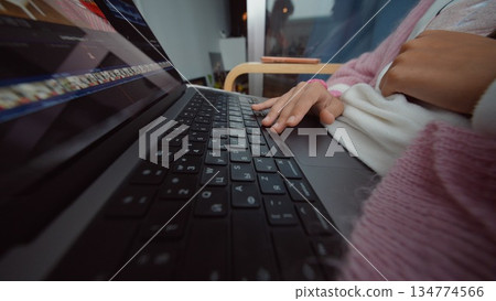 Detailed shot of hands engaging with keyboard equipment Detailed shot of hands engaging with keyboard equipment 134774566