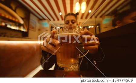 Afterwork doubletoast with beer mugs, young professional Afterwork doubletoast with beer mugs, young professional 134774569