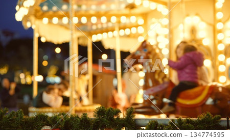 Family enjoying lively amusement park scene with cheerful child Family enjoying lively amusement park scene with cheerful child 134774595