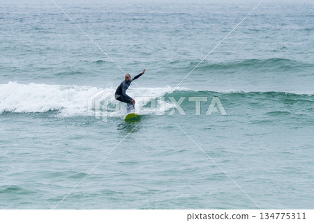 Surfer riding waves Surfer riding waves 134775311