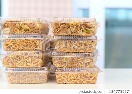 Stacks of packed fried noodles Stacks of packed fried noodles 134775927