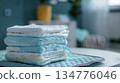 Stack of clean diapers sitting on baby changing table 134776046