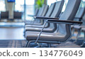 Row of empty chairs waiting in modern airport terminal 134776049